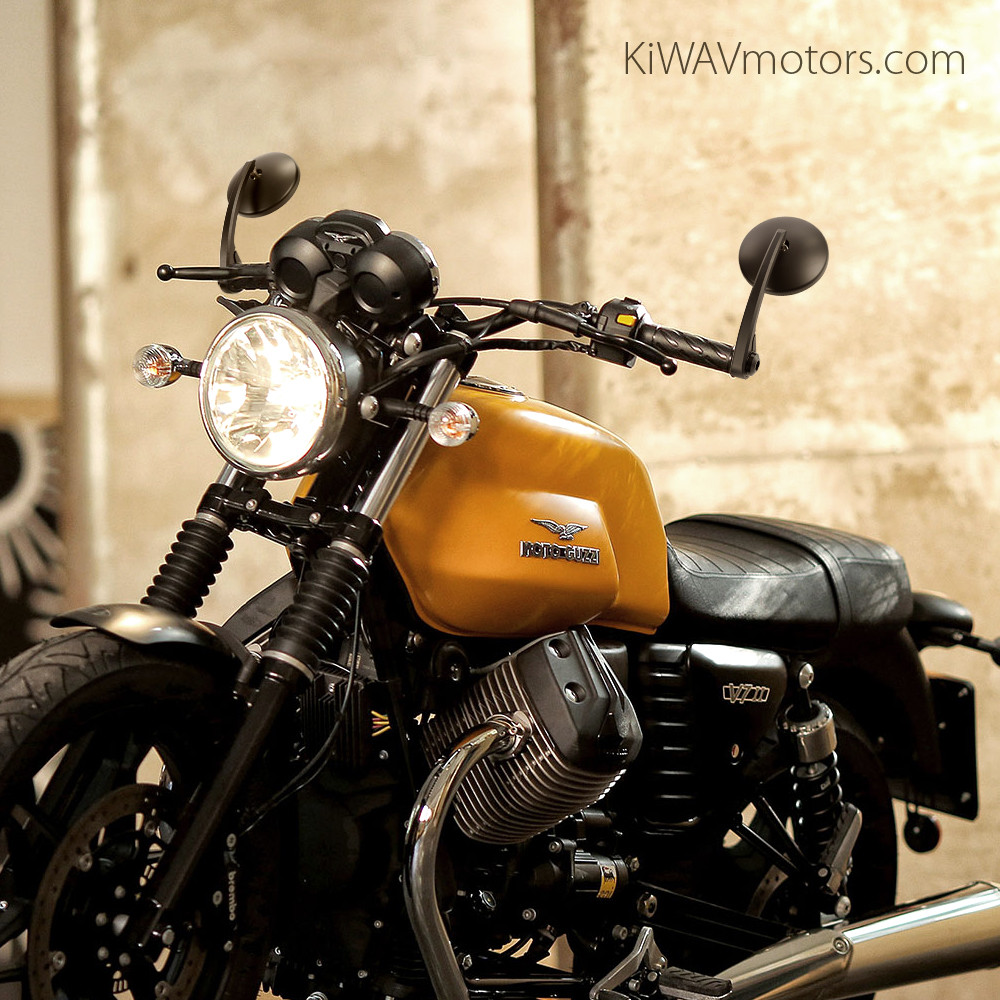 KiWAV Eclipse black bar-end mirror installed on yellow Moto Guzzi V7 II Stone motorcycle