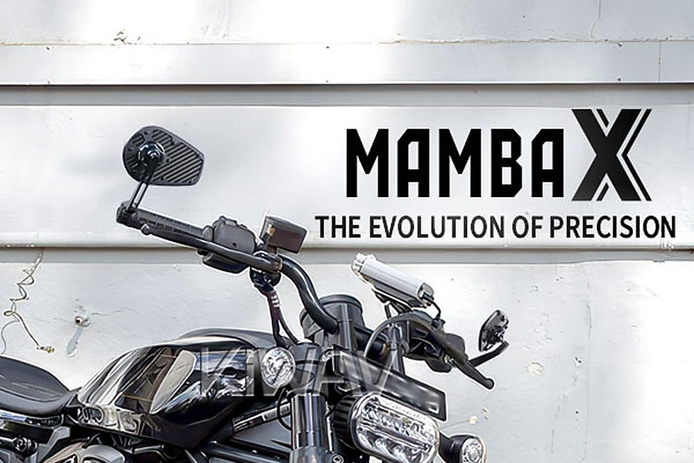 KiWAV MambaX bar-end mirrors on a Harley-Davidson Sportster S, gloss carbon fiber mirror face framed by CNC-milled aluminum with ball-joint adjustment