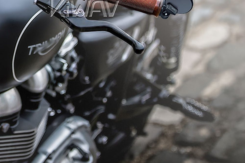 KiWAV black round bar-end mirror on a Triumph Bobber handlebar with brown grips, low-profile entry-level design