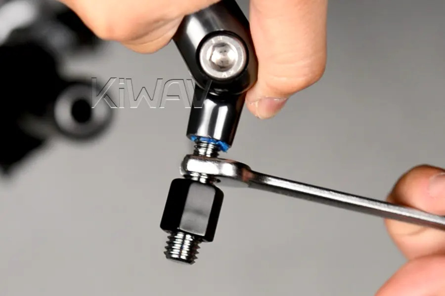 Thread the adapter (threadlocker side) into the mirror stem.