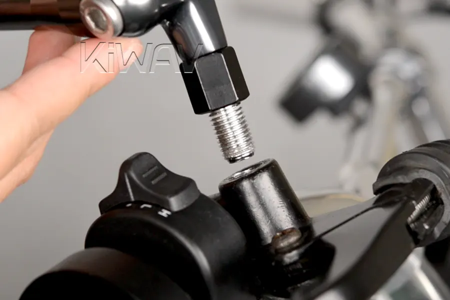 Thread the mirror assembly into the handlebar perch.