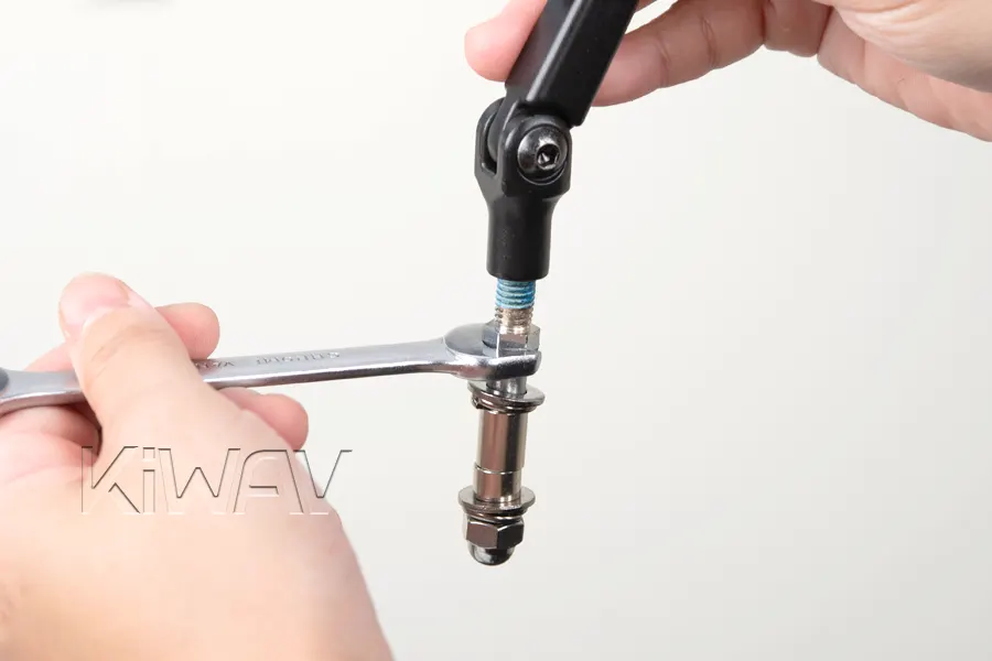 Thread the adapter into the mirror stem.