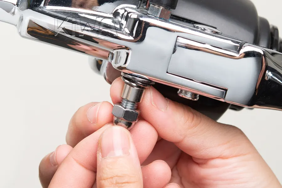 Thread the acorn nut onto the stud by hand first to ensure no cross-threading occurs.