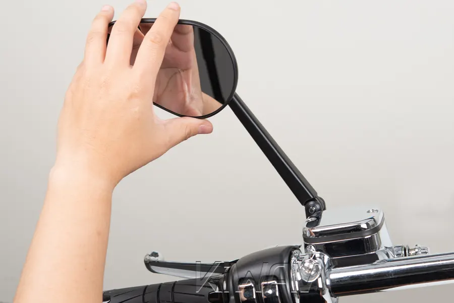 Fine-tune any adjustable joints on the mirror stem or plate in riding position.