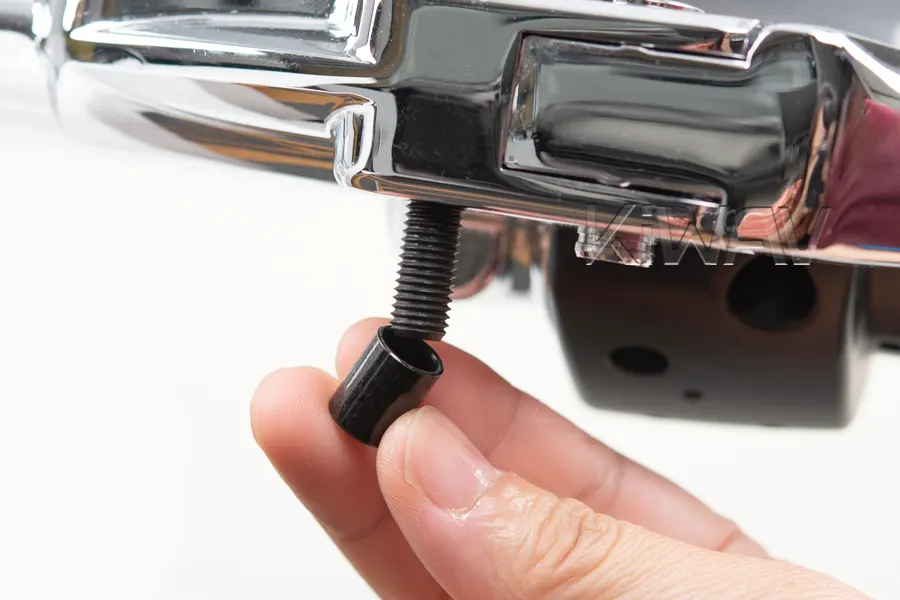 Place washers and spacers onto the protruding thread on the opposite side.