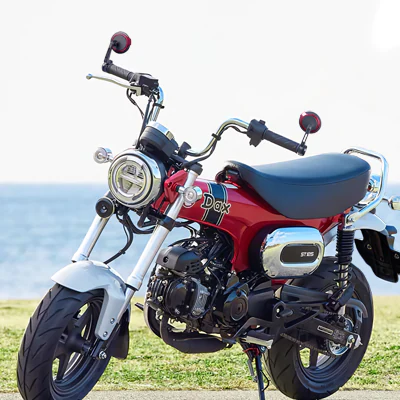 Aura red bar end mirrors on a Honda Dax