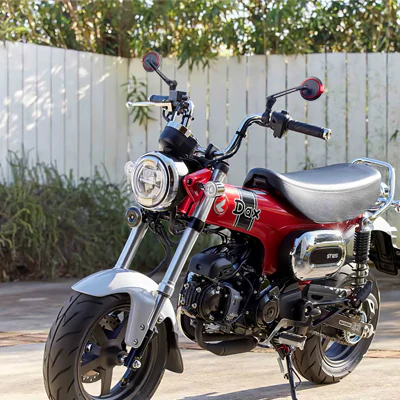 Aura red motorcycle mirrors on a Honda Dax