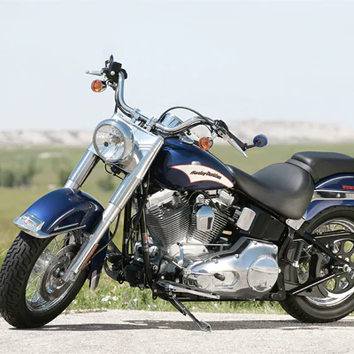 Aura blue bar end mirrors on a Harley softail breakout